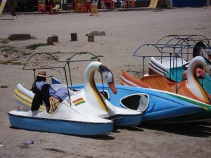 Bolivian woman sleeping in tourist boat