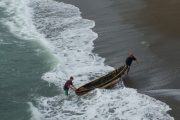 Fishermen pulling boat