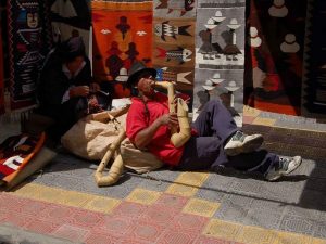 Playing pan flute Otavalo